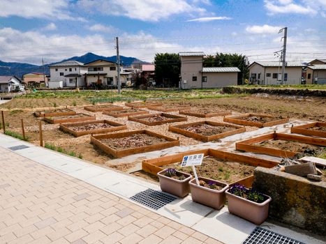 Minimal plantation farm in town, Shimoyoshida Japan, Cloud and blue sky backgroud. Harvest and Soil preparation in April