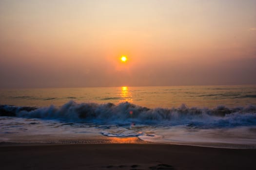 Sunset or Sundown on Sea. Bright sun on sky. Sunrises Orange beach landscape
