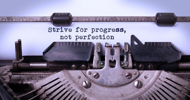 Strive for progress, not perfection - Written on an old typewriter, vintage