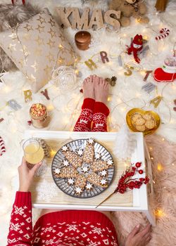 Christmas food and drink among Christmas decorations in the cosy home