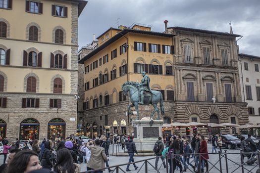 Piazza della Signoria in Florence full of tourists who visit it during a Winter Day