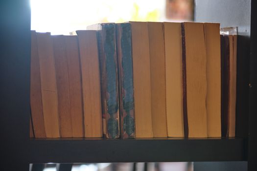 The Selective focus point on Old vintage book with the window light