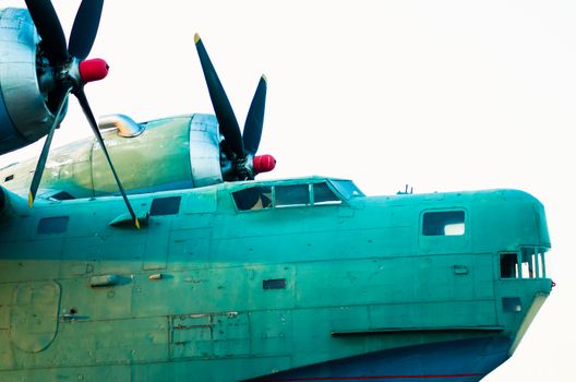 cockpit and propeller blades of an old vintage cargo plane close up