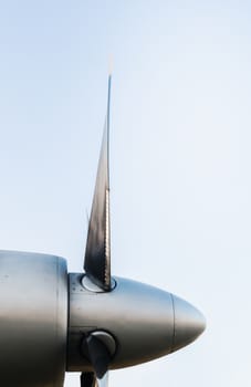 airplane propeller blades on blue background isolated close up