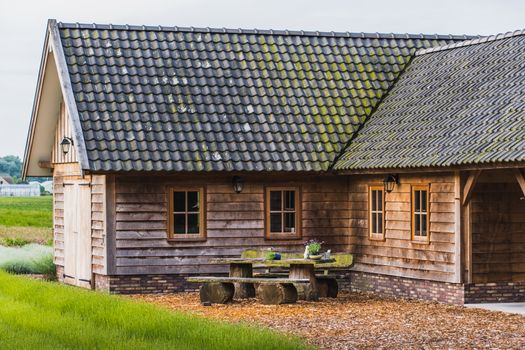 Old rustic and charming wooden house in the middle of a lavender field