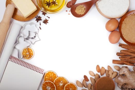 Christmas gingerbread cookies cooking background flat lay top view template with copy space for text. Baking utensils, spices and food ingredients border frame isolated on white background