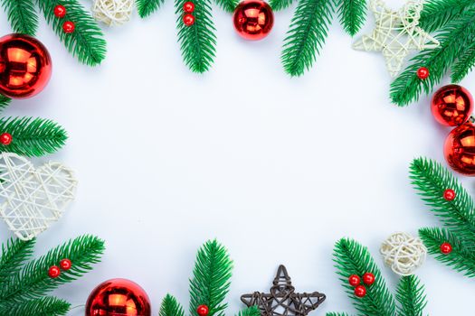 Christmas holidays composition, top view of red and gold Christmas decorations on white background with copy space for text. Flat lay, winter, postcard template, new year concept.