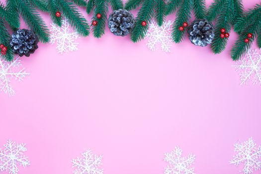 Christmas holidays composition, top view of red Christmas decorations on pink background with copy space for text. Flat lay, winter, postcard template, new year concept.