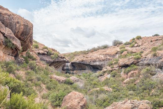 Landscape on the Cannibal Hiking Trail near Clarens in the Free State Province. The Bat Wing Waterfall is visible