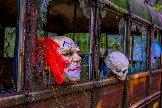 Spooky Masks on a rusted out old school Bus