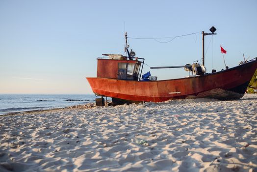 fisherman boats at sunrise time on the beach in summer