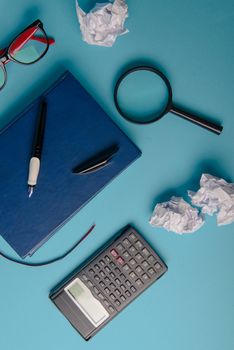 Desk with Tools and Notebook office desk on blue background