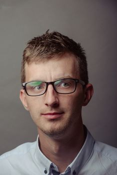 Portrait of a smart serious young man.
