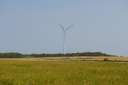 wind trubine at sunny day with blue sky