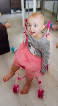 Portrait of adorable baby girl. Childhood. Authentic image
