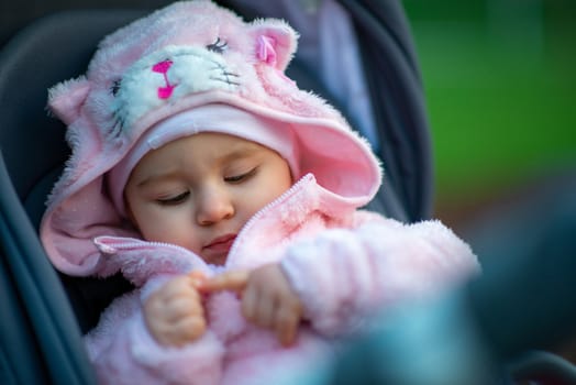Little girl spending fantastic time on playground. Happy childhood. Authentic image