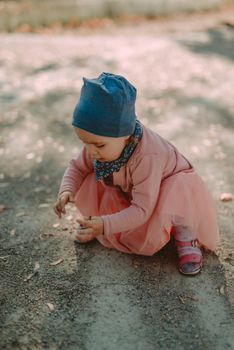 Adorable girl having fun on beautiful autumn day. authentic childhood image