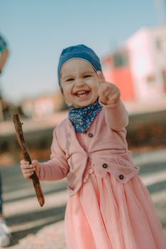 Adorable girl having fun on beautiful autumn day. authentic childhood image