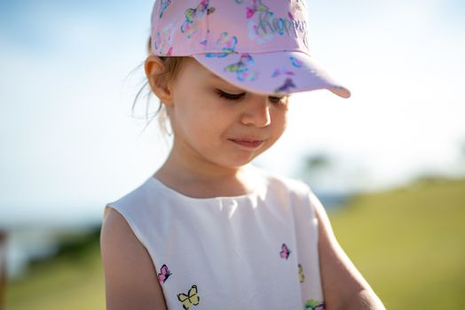 Little girl spending fantastic time on playground. Happy childhood. Authentic image