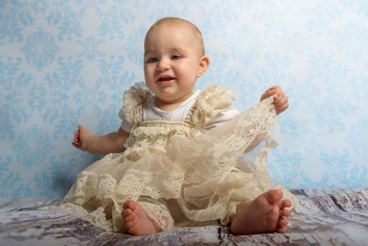 Portrait of adorable baby girl. Childhood. Authentic image