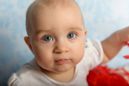 Portrait of adorable baby girl. Childhood. Authentic image