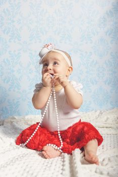 Portrait of adorable baby girl. Childhood. Authentic image
