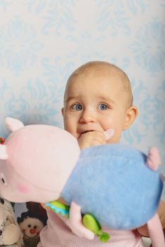 Portrait of adorable baby girl. Childhood. Authentic image