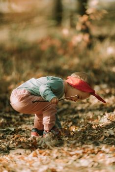 Adorable girl having fun on beautiful autumn day. authentic childhood image