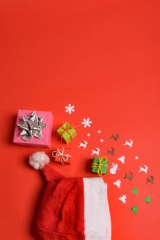 Christmas or New Year background, plain composition made of Xmas decorations and fir branches, flat lay, blank space for a greeting text.