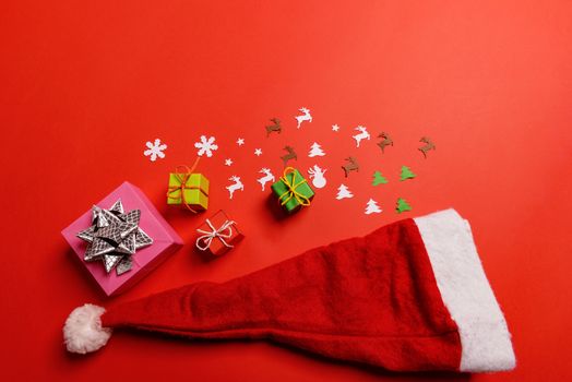 Christmas or New Year background, plain composition made of Xmas decorations and fir branches, flat lay, blank space for a greeting text.