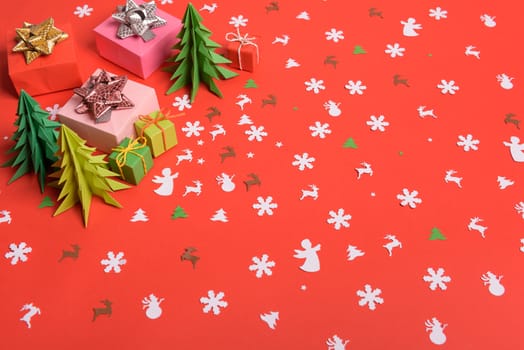 Christmas or New Year background, plain composition made of Xmas decorations and fir branches, flat lay, blank space for a greeting text.