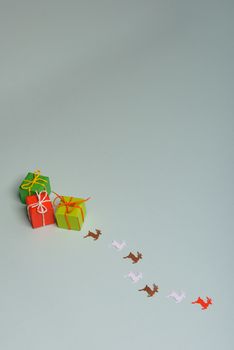christmas presents nicely decorated with bows and feathers. view from above. Reindeers.