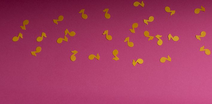 Paper colorful music notes background. View above.