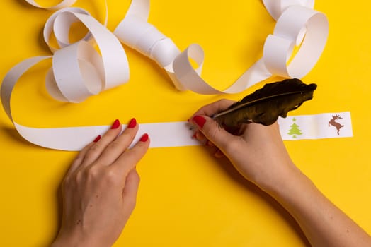 Long twisted expanded letter for Santa Claus. Copy space. yellow background