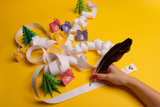 Long twisted expanded letter for Santa Claus. Copy space. yellow background
