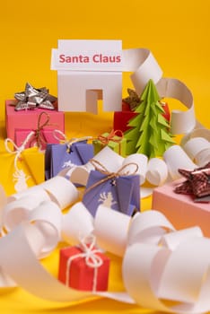 Long twisted expanded letter for Santa Claus. Copy space. yellow background