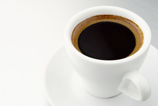 white coffee cup and saucer on the table