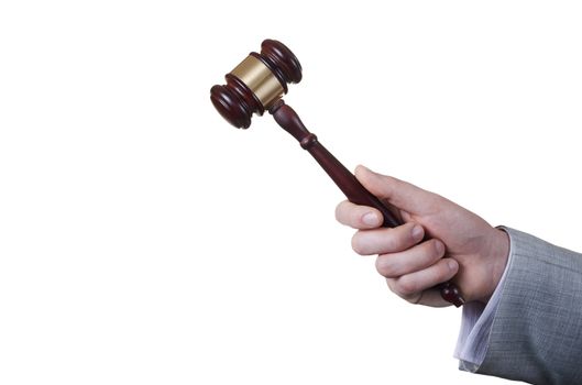 gavel in the hand of a man in a business suit