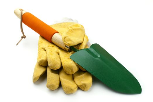 garden trowel and gloves on a white background