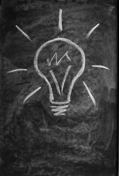light bulb drawn with chalk on blackboard