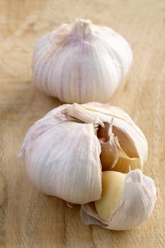 garlic on a wooden board with a blurred background