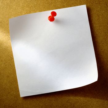 white sheet of paper for notes and pushpin