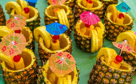 Paper Umbrellas in Pineapple Drinks at a Night Market