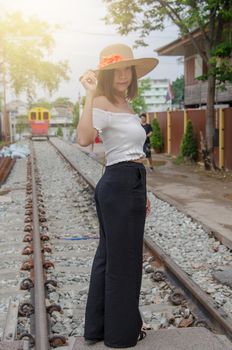 lifestyle fashion portrait woman asian at the train.