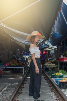 lifestyle fashion portrait woman asian at the train.