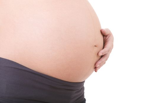 Closeup of pregnant woman at white background