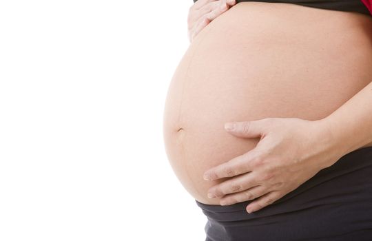 Closeup of pregnant woman at white background