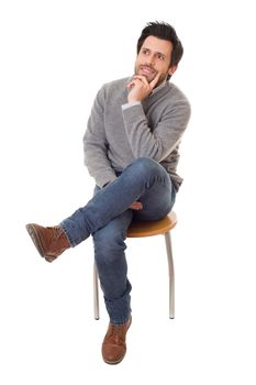 happy casual man on a chair, isolated on white background