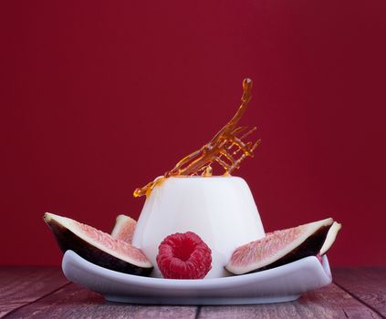 Wonderful Blancmange dairy healthy dessert with fig and raspberries and dry caramel