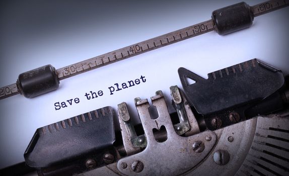 Save the planet, written on an old typewriter, vintage